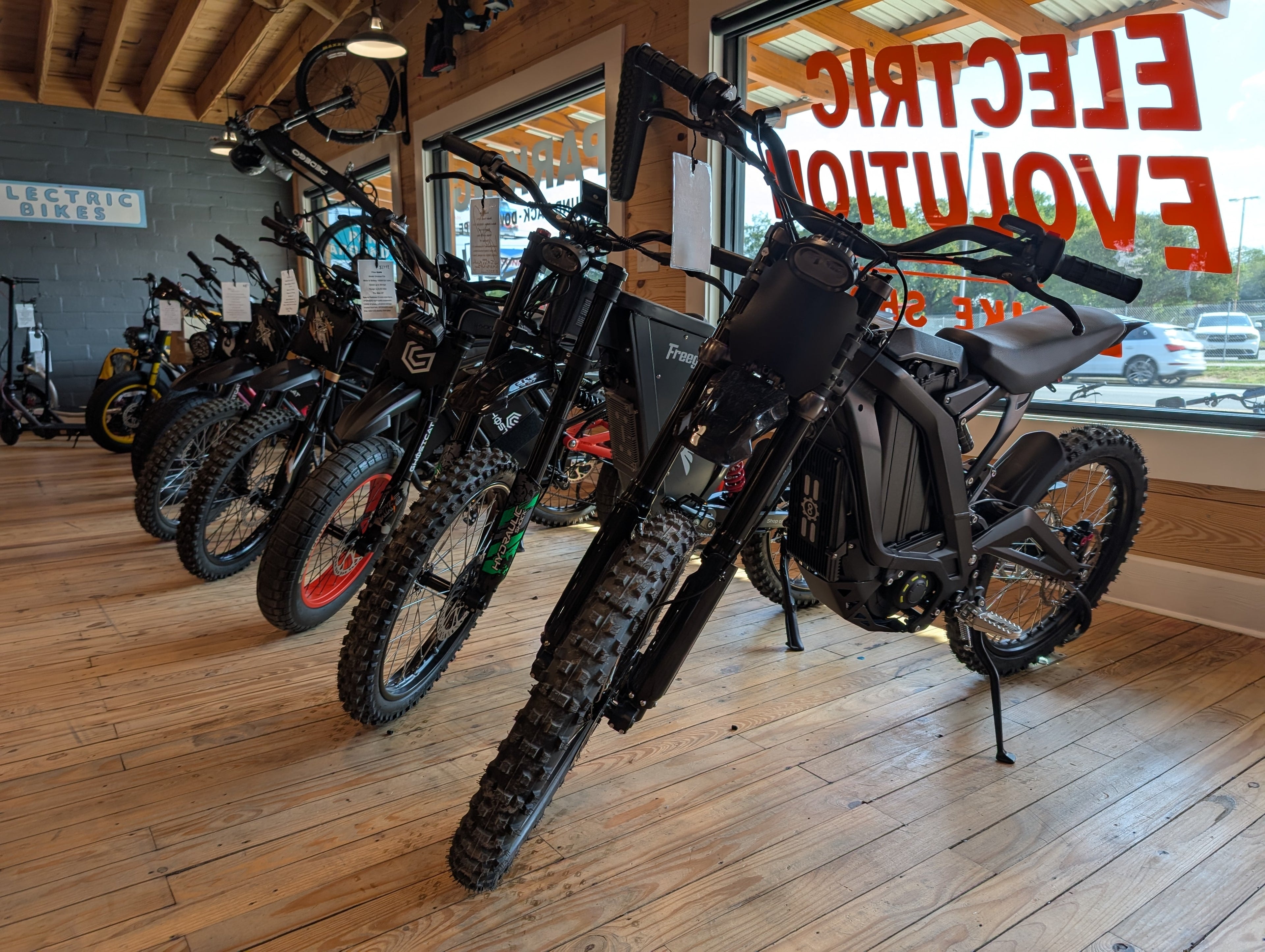 Rows of electric dirt bikes at Electric Evolution showroom